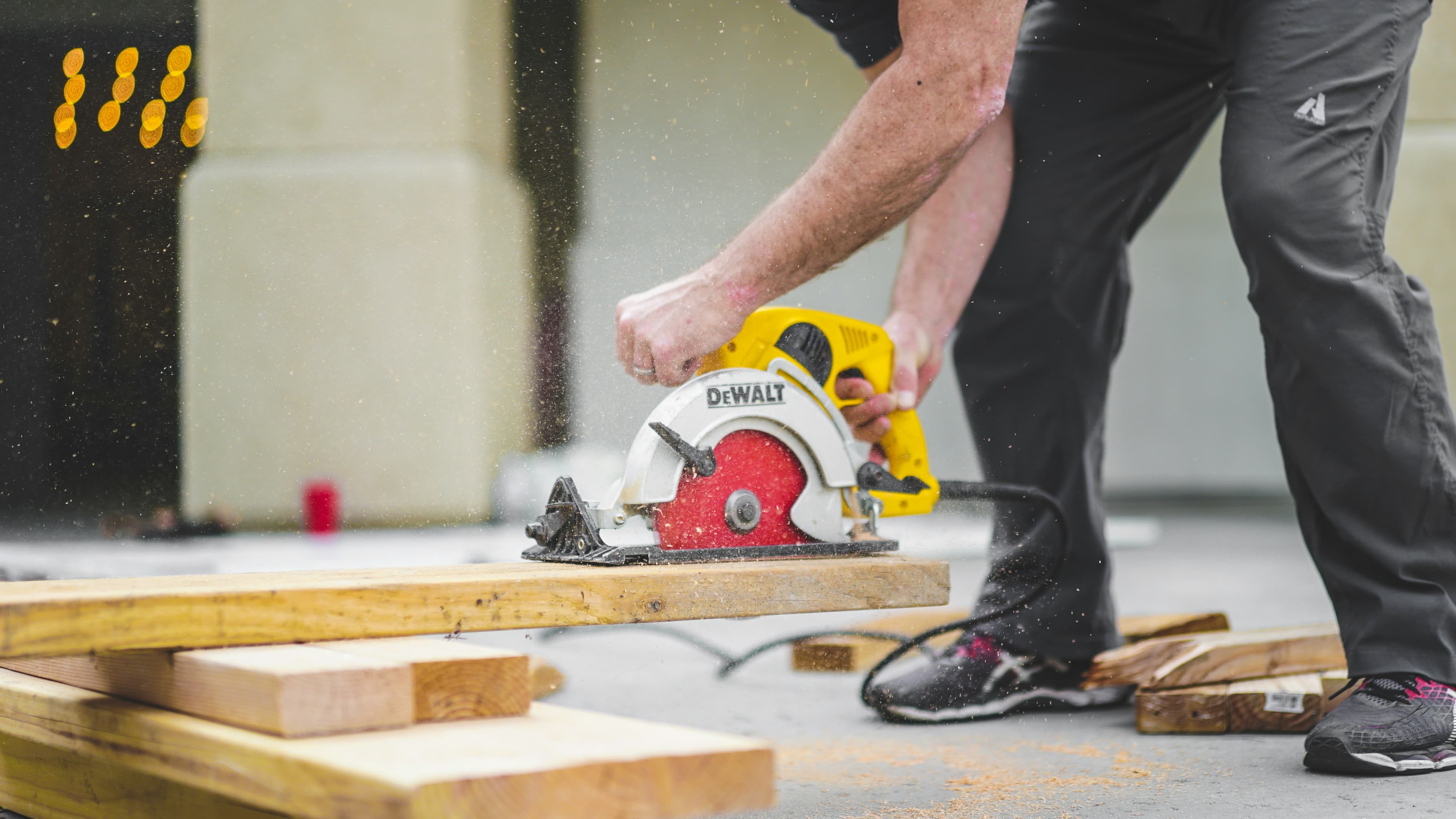 Construction professional cutting lumber with precision tools